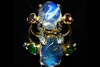 Two Moonstone rings with Rubies and Tsavorites with Diamonds in 18ct gold
