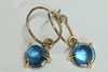 Blue topaz earrings with 22ct gold claws and 18ct white gold